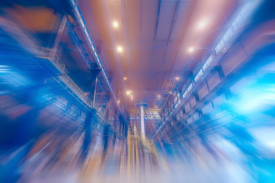 Blurred photo of an industrial warehouse focusing on energy savings