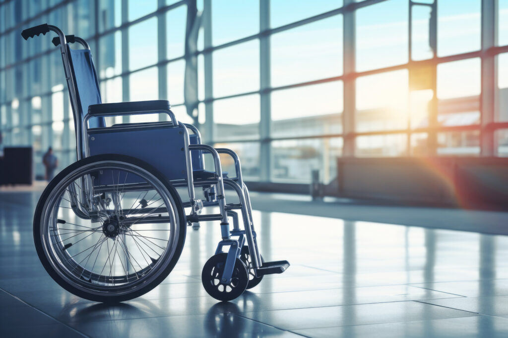 A wheelchair positioned in the airport terminal—an everyday reminder that accessibility supports travelers with diverse and situational needs.